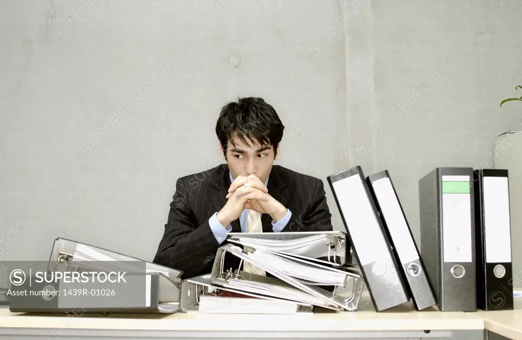 Businessman with messy desk