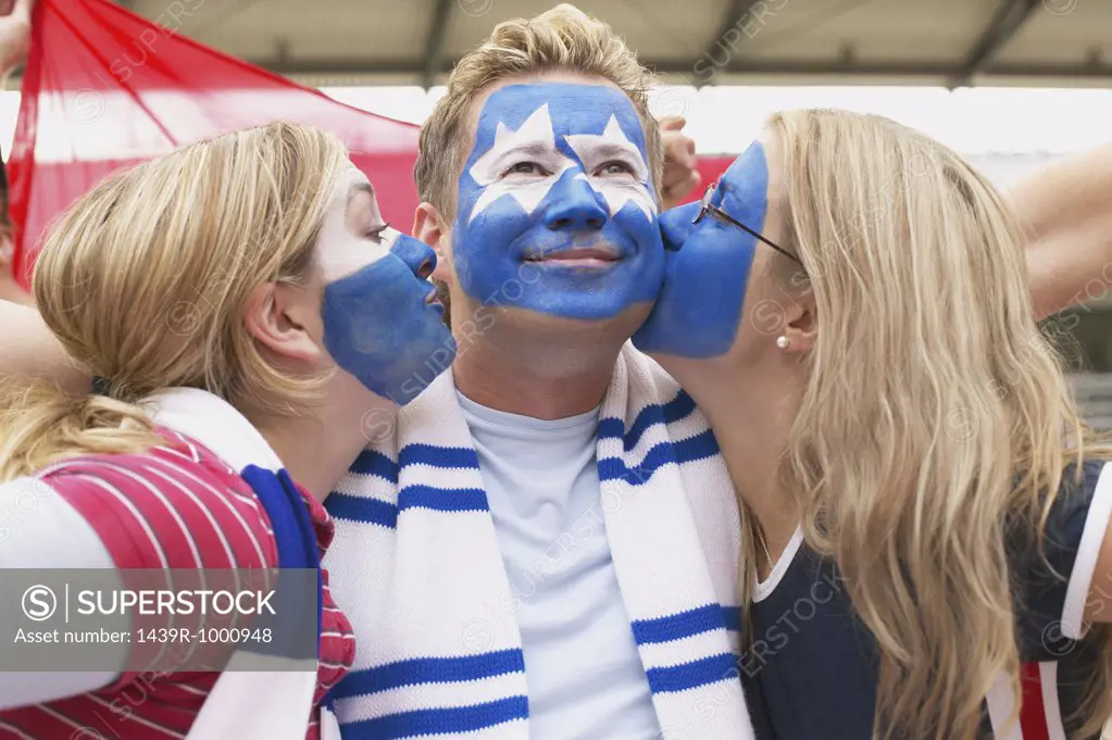 Footballer supporters kissing