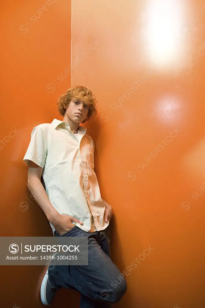 Teenage boy standing alone