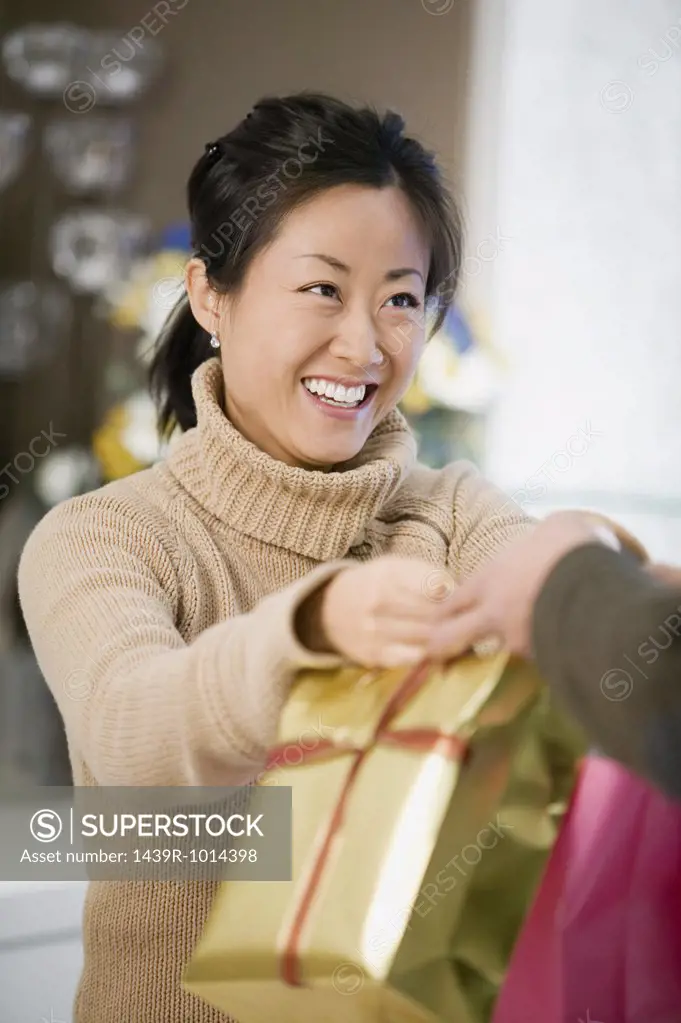 Woman handing over bags