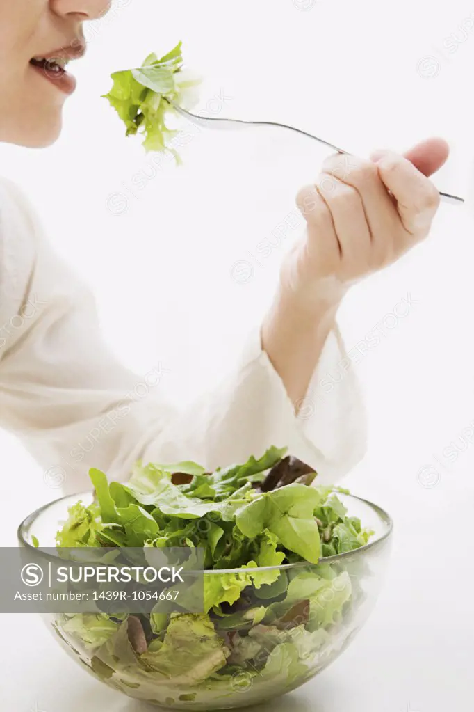 Woman eating lettuce