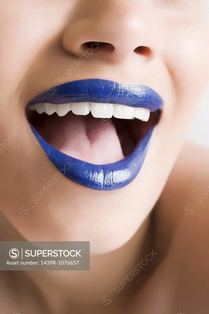 A woman wearing blue lipstick