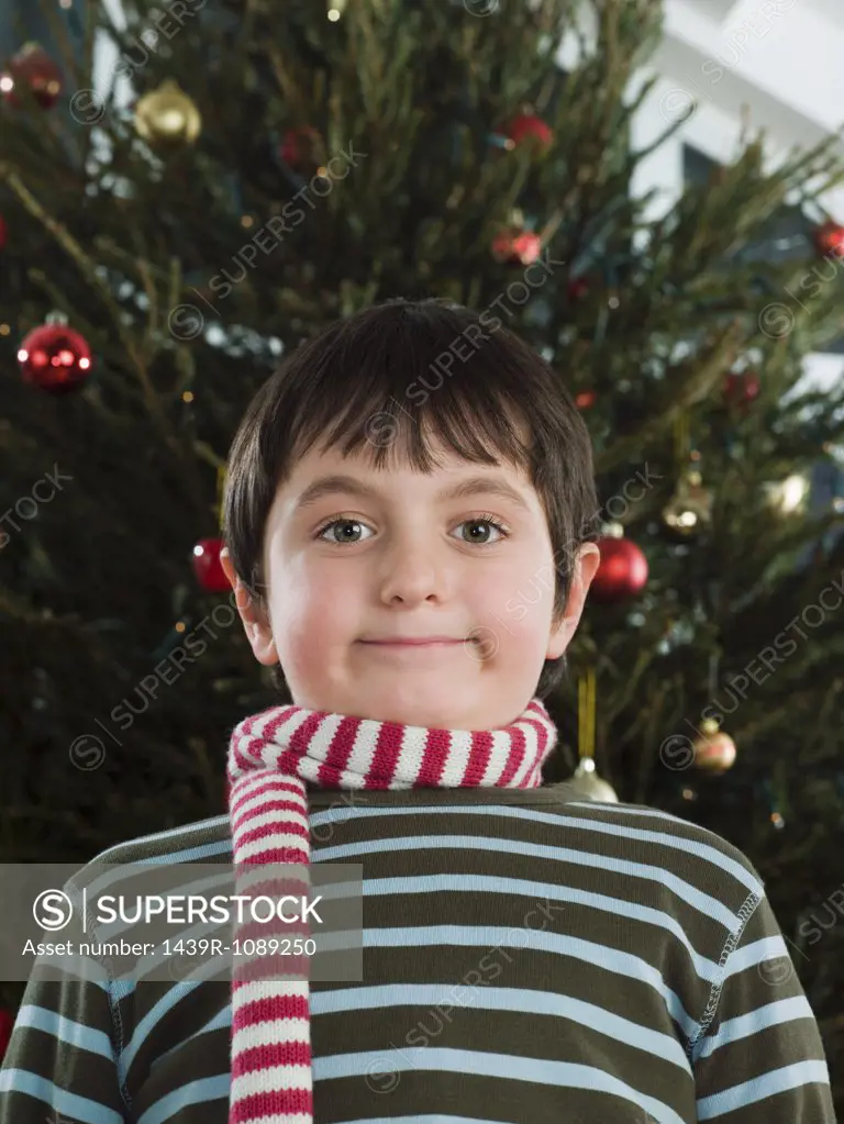 Boy wearing a scarf at christmas