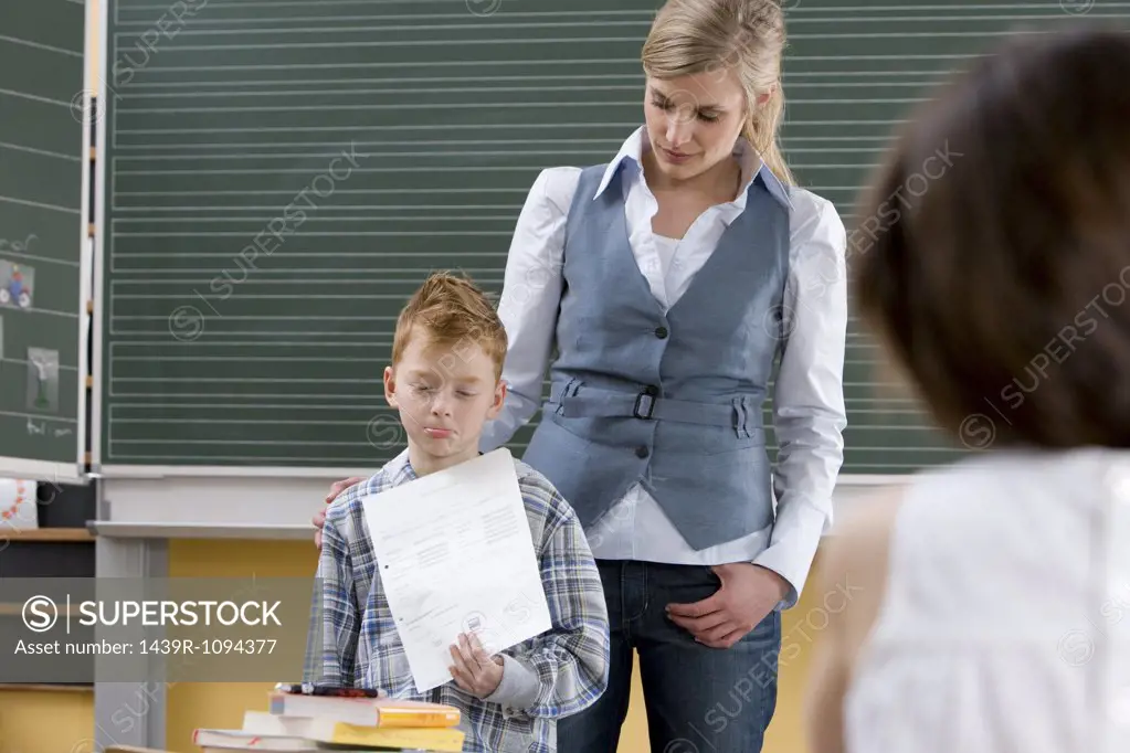 Boy looking sad in classroom