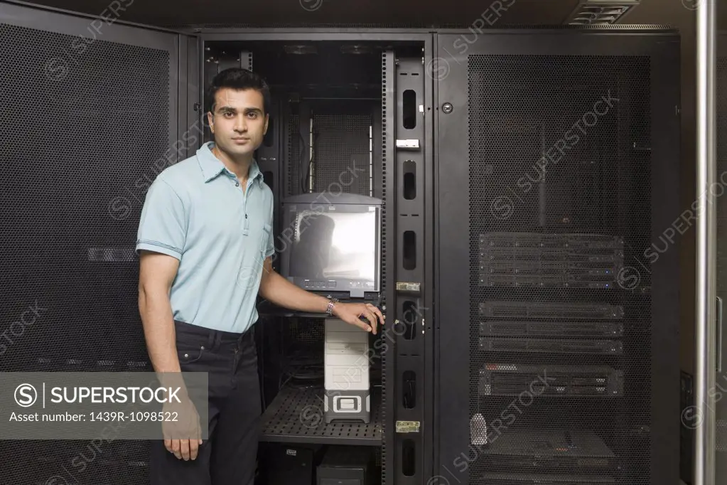 Computer technician working on a server