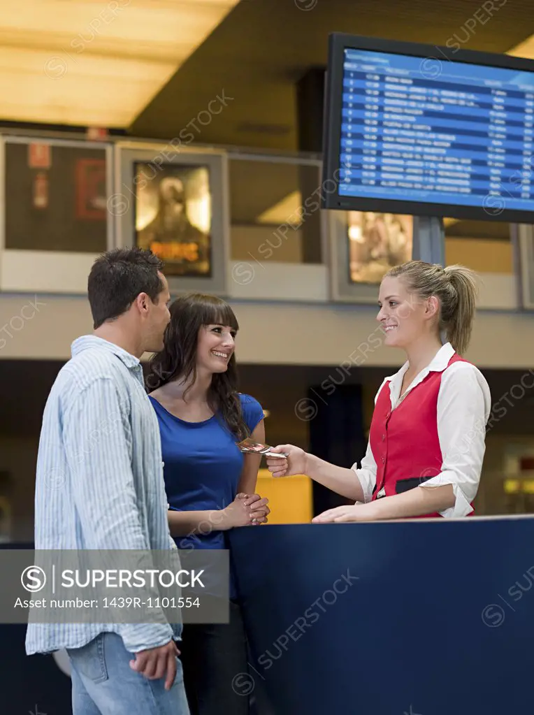 A couple buying tickets from the box office