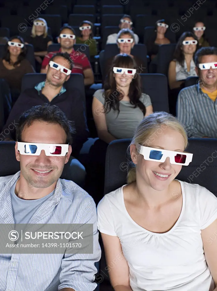 A cinema audience watching a 3d movie