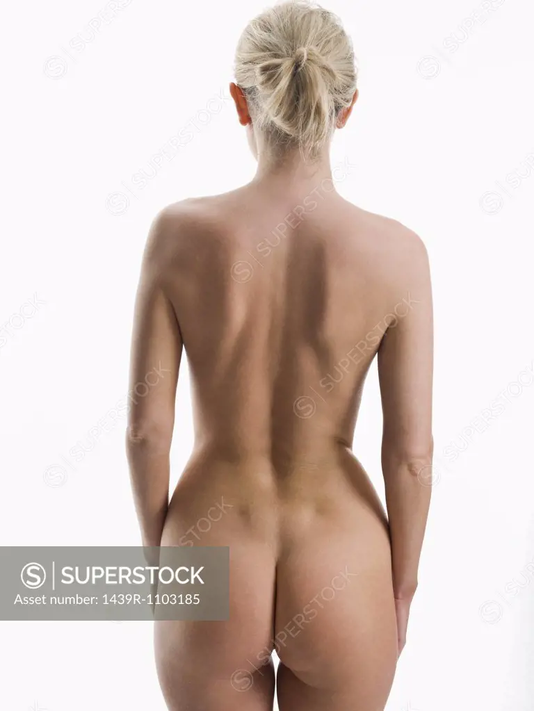 Rear view of nude woman - SuperStock