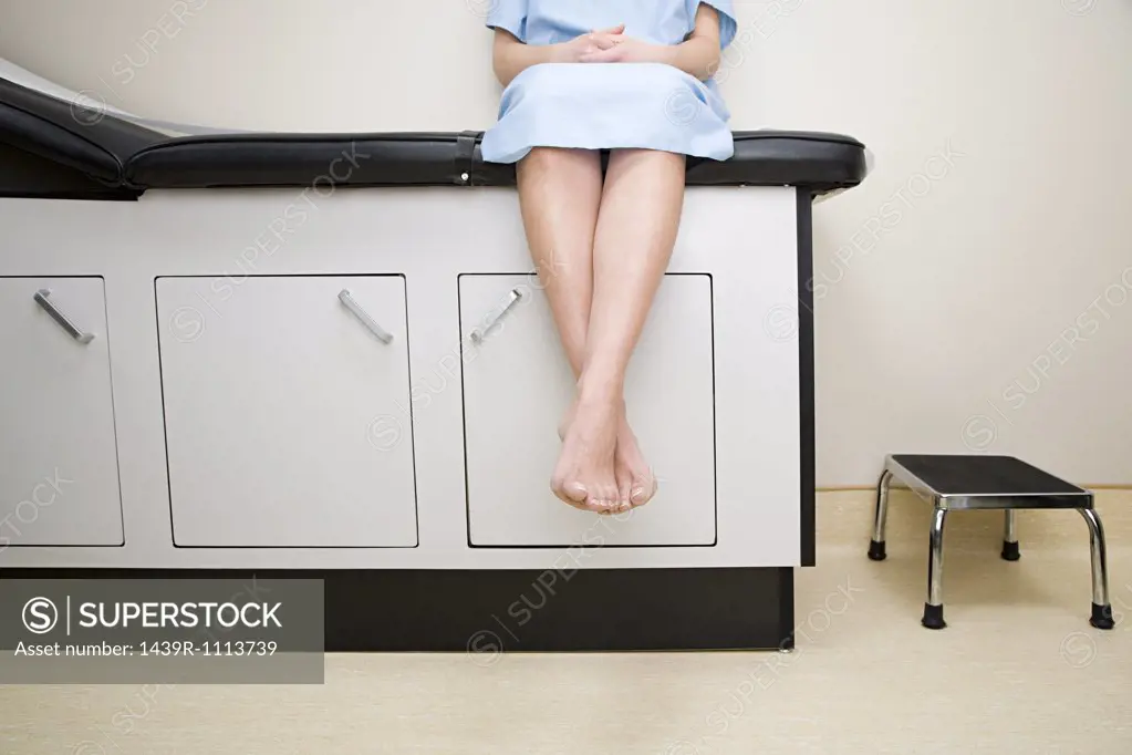 Patient sitting on treatment couch