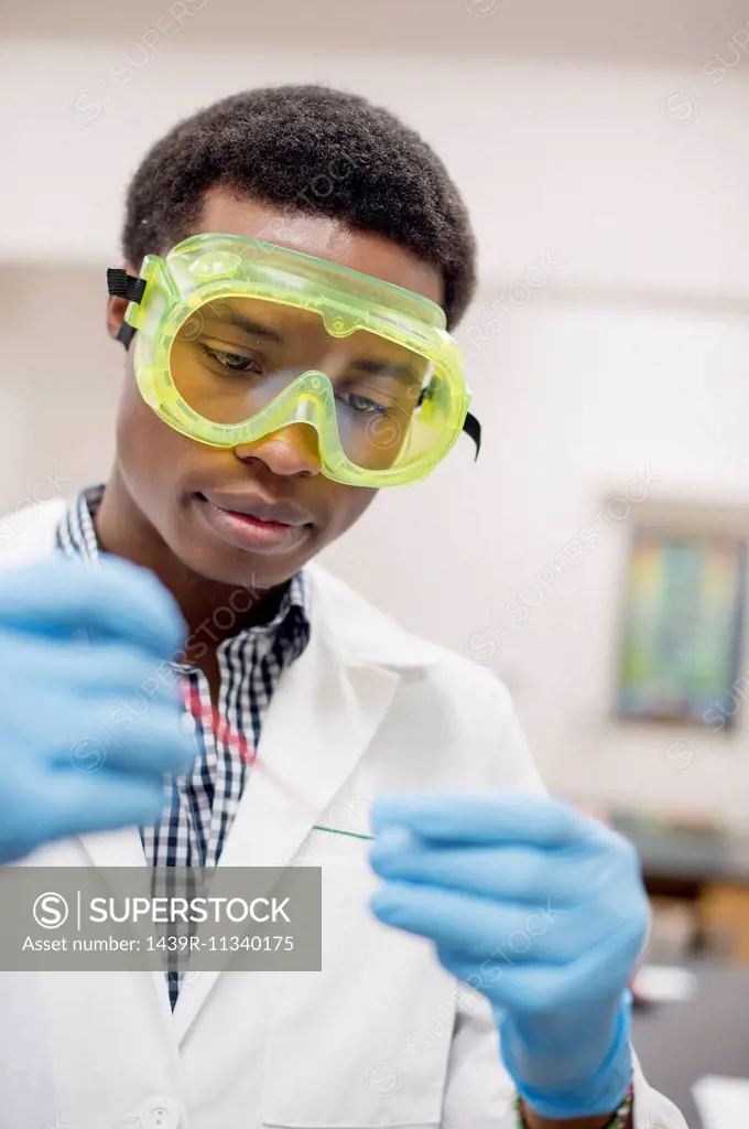 Science student wearing protective goggles