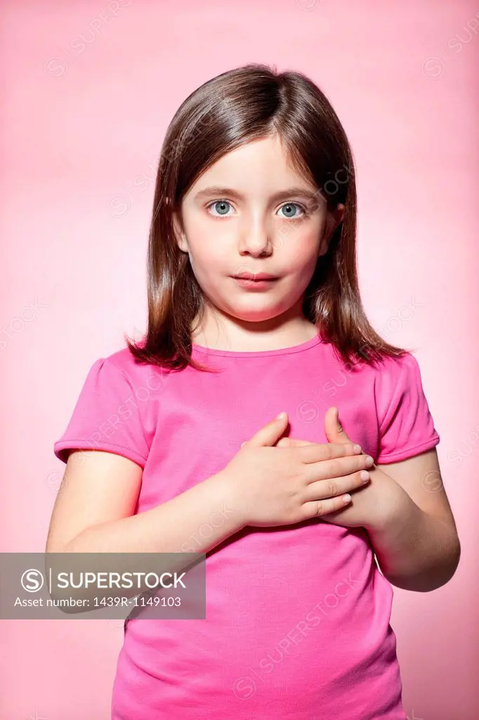 Girl with hands on heart