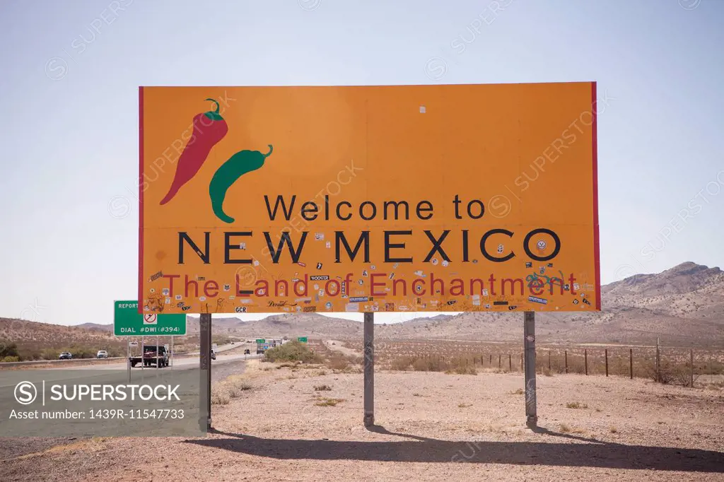 Road sign and highway, New Mexico State Line, USA