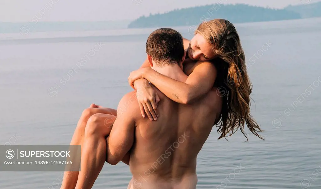 Young Naked Man Carrying Nude Woman. Stock Photo, Picture and Royalty Free  Image. Image 38820129.