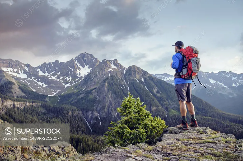 Hiker on mountain peak, Mount Sneffels, Ouray, Colorado, USA