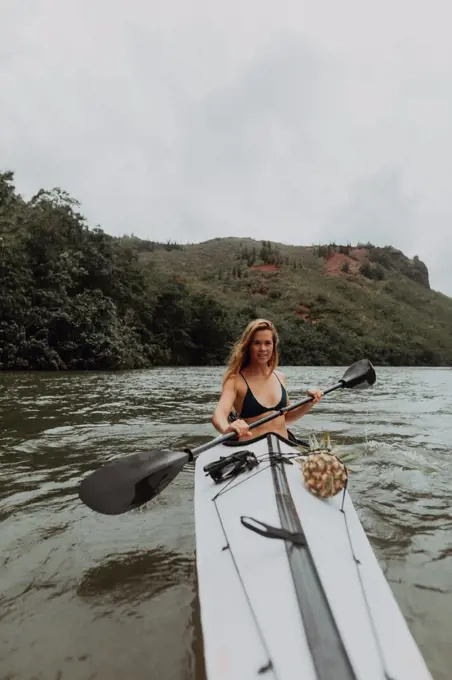 Woman kayaking, Princeville, Hawaii, US