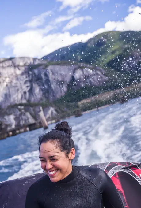 Woman travelling on speedboat, Squamish, Canada