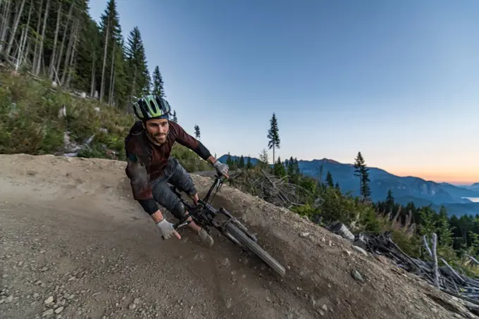 Mountain biker on hill, Squamish, British Columbia, Canada