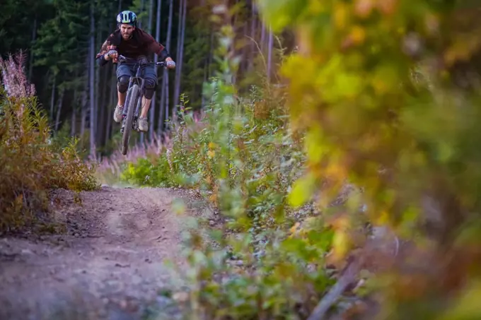 Man on mountain bike in mid air, Squamish, British Columbia, Canada