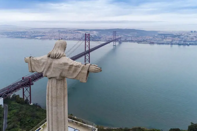 Portugal, Lisbon, Christ the King statue and 25 de Abril Bridge
