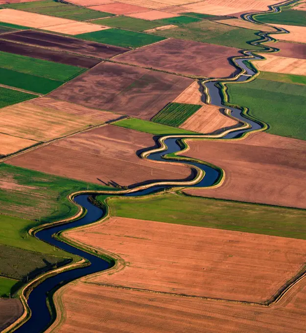 UK, Lytham St. Annes, Aerial view of river meandering through fields