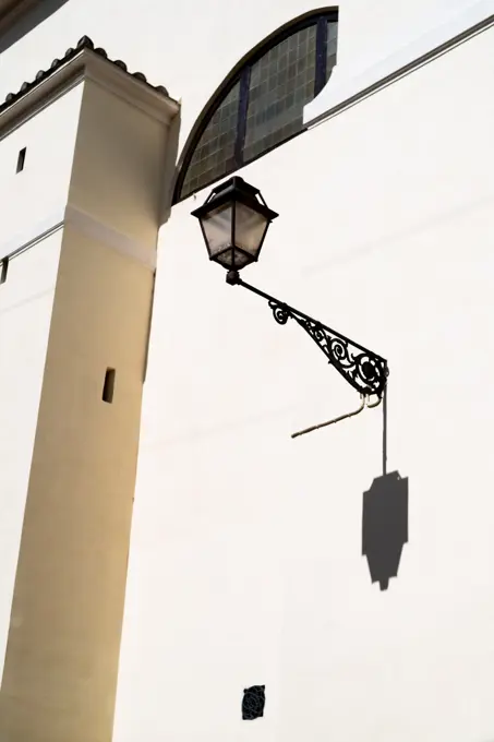 Italy, Rome, Wall with lantern on sunny day