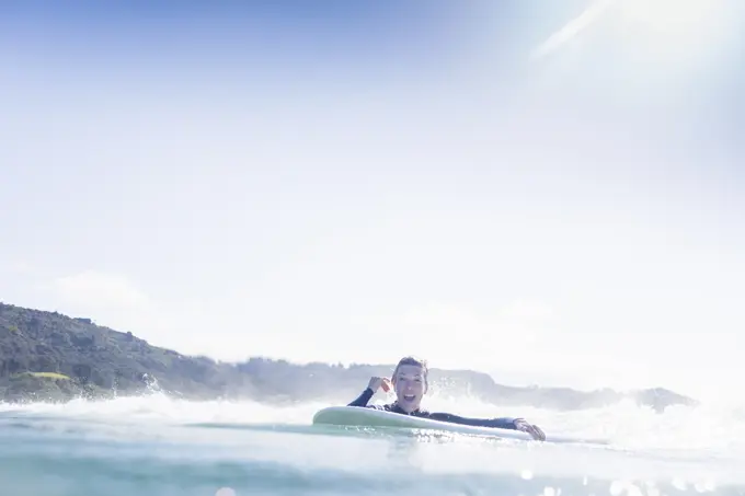 Surfer in the water, Bay of Islands, New Zealand