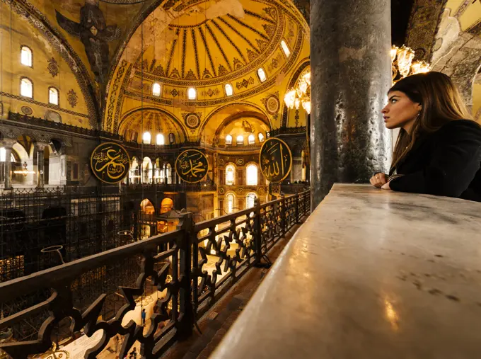 Young woman inside Hagia Sophia mosque, Istanbul, Turkey