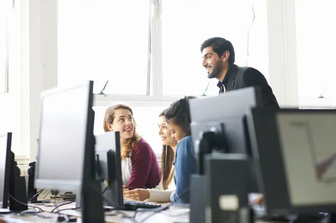 Group of students working in computer classroom