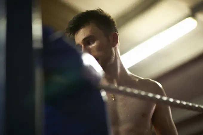 Boxer working out in boxing ring