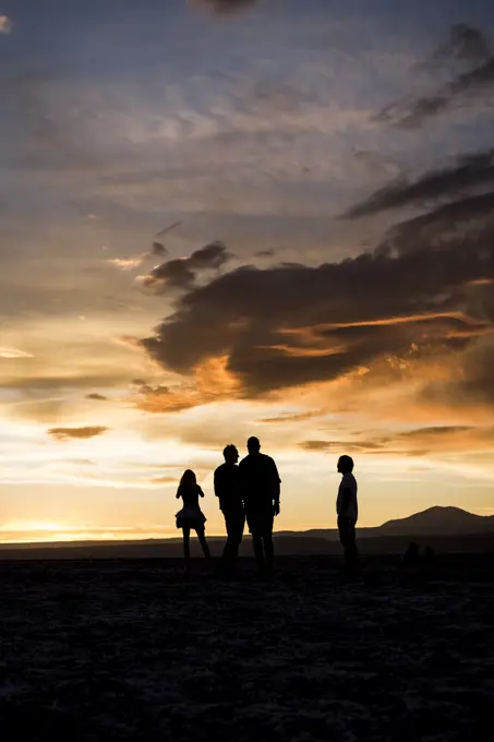 Silhouette of people in desert at sunset, San Pedro de Atacama, Chile