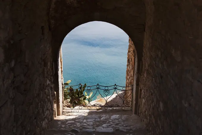 Archway view of blue sea, Nafplio, Greece