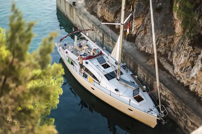 High angle portrait of man waving from yacht, Croatia