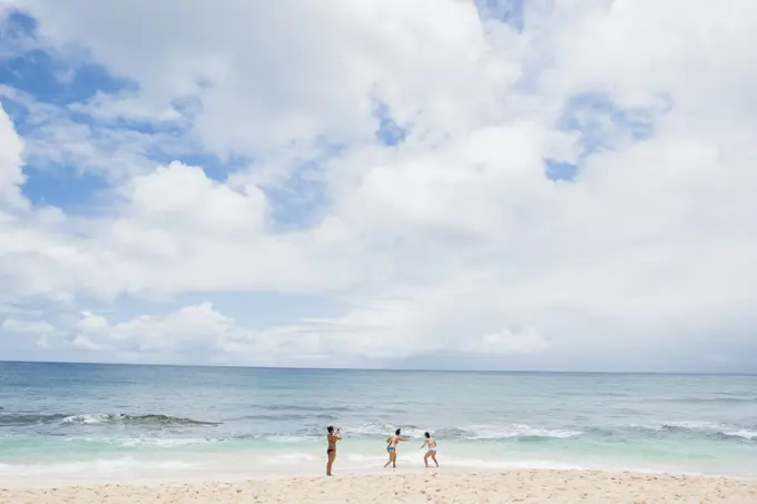 Friends enjoying Sunset Beach, Oahu, Hawaii