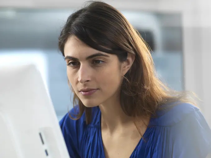 Woman working at computer in office