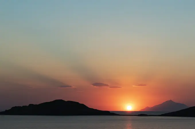 Scenic sunset over coastal mountains, Limnos, Khios, Greece