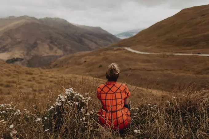 Woman enjoying view of scenic landscape, Queenstown, Canterbury, New Zealand