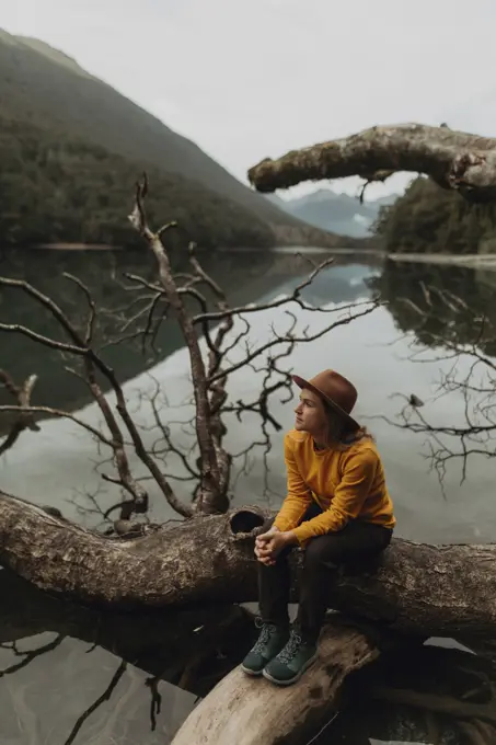 Woman enjoying scenic lake view, Queenstown, Canterbury, New Zealand