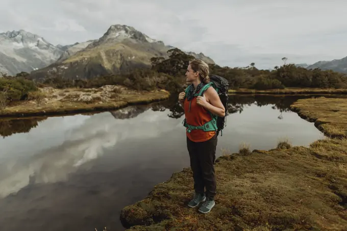 Hiker enjoying scenic lake view, Queenstown, Canterbury, New Zealand