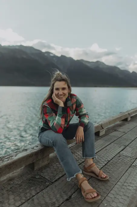 Woman enjoying scenic lake view, Queenstown, Canterbury, New Zealand