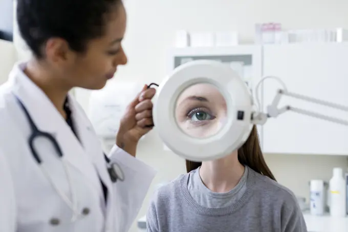 Doctor giving patient eye test