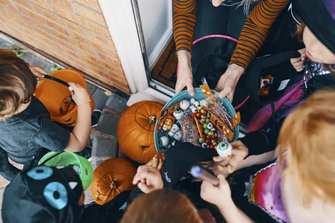 Trickortreaters gather treats on Halloween