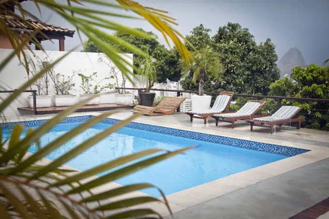 Swimming pool on terrace, Sugarloaf Mountain in background, Rio, Brazil