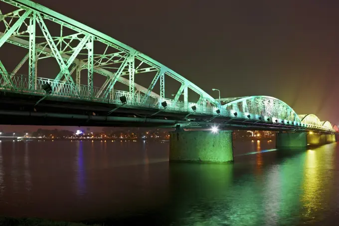 Illuminated Trang Tien Bridge over Perfume River, Hue, Vietnam