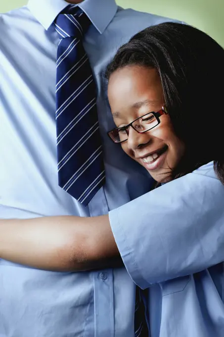 Schoolgirl hugging brother