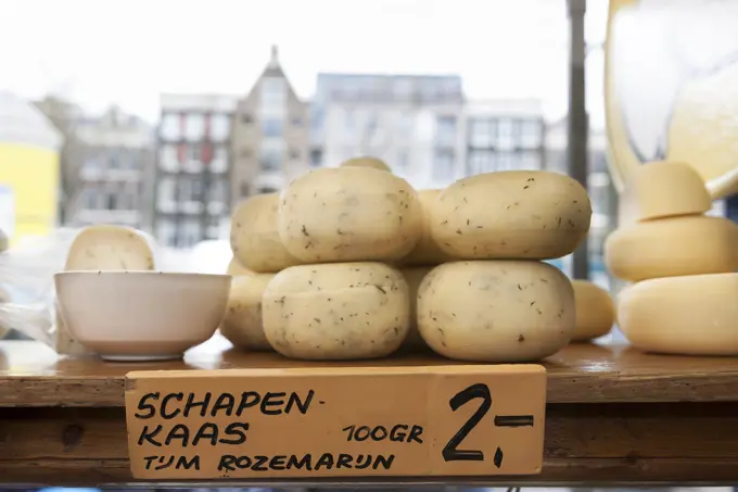 Round cheeses in shop window, Amsterdam, Netherlands