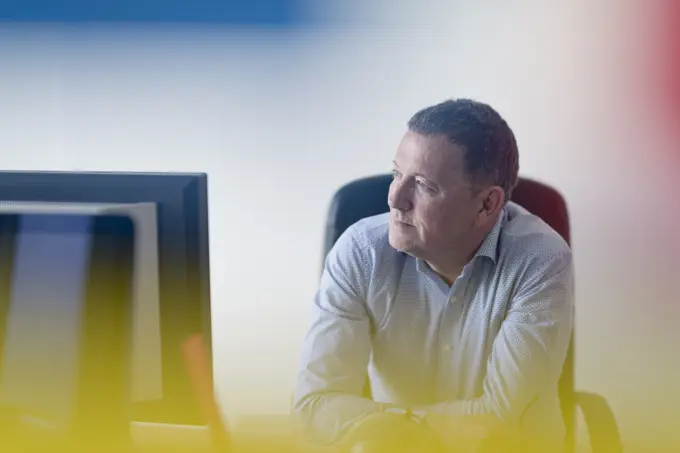 Focused professional working intently at his computer.