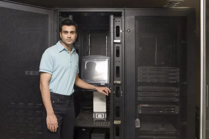 Computer technician working on a server