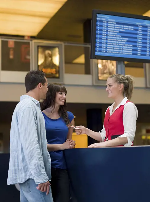 A couple buying tickets from the box office