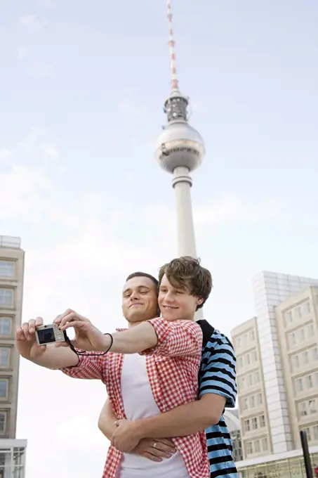 A gay couple photographing themselves