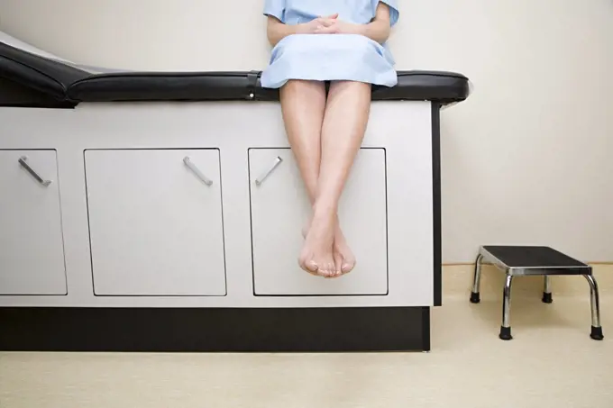 Patient sitting on treatment couch